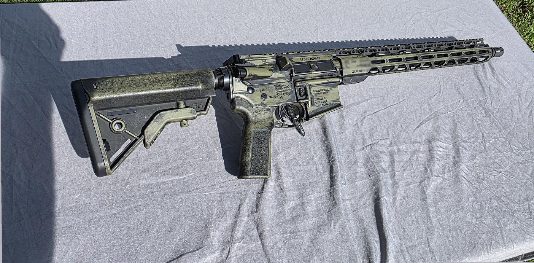 AR-style rifle in battleworn Cerakote